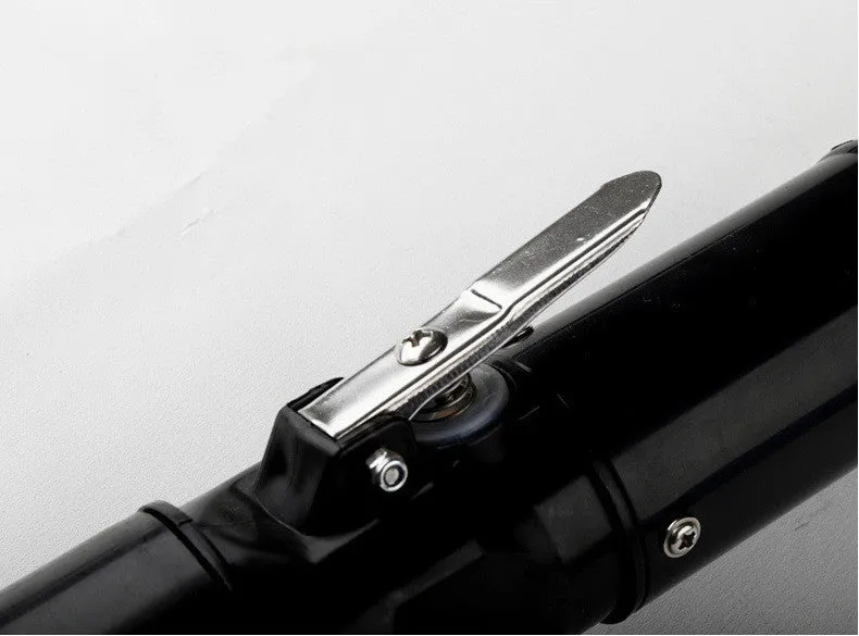 Black electric fish scale scraper with plastic shell and alloy parts, 7000 r/min descaling tool on a table