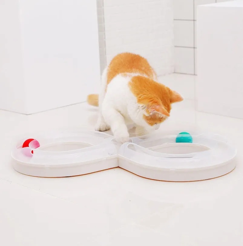 Cat toy turntable with a ball on a circular track, white and blue plastic, 50cm wide, for interactive play