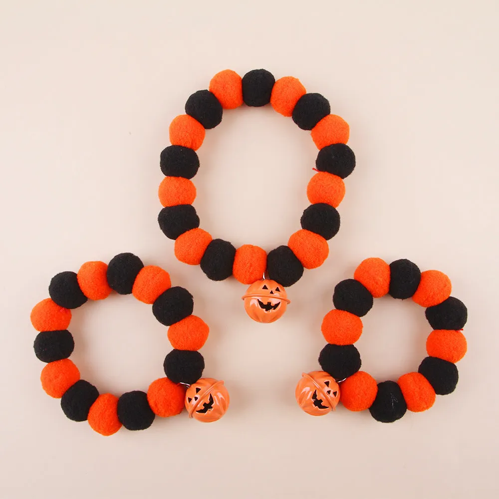 Naughty cat collar with pumpkin trick or treat design and bell ball in Halloween style
