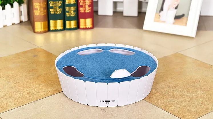 Automatic cat teaser toy with rotating non-woven mouse, blue colour, on a light floor