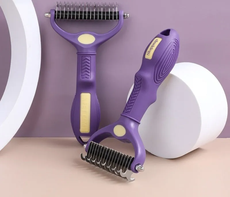 Purple double-sided plastic pet comb for detangling dog and cat fur.