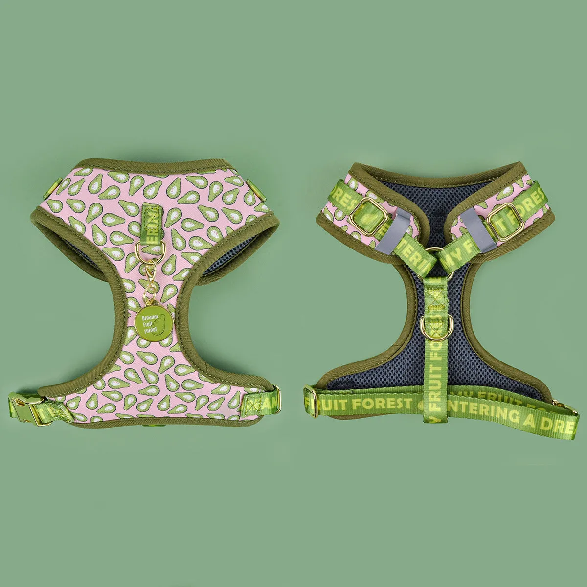 Adjustable polyester dog breast strap harness in Pink Avocado colour on a wooden surface