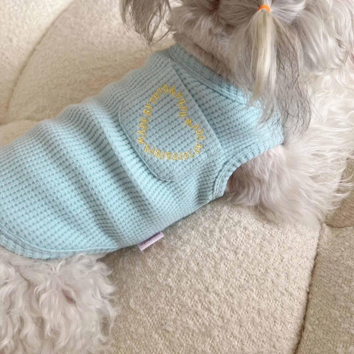 Lightweight polyester summer dog vest in oat grey, side view on a small dog