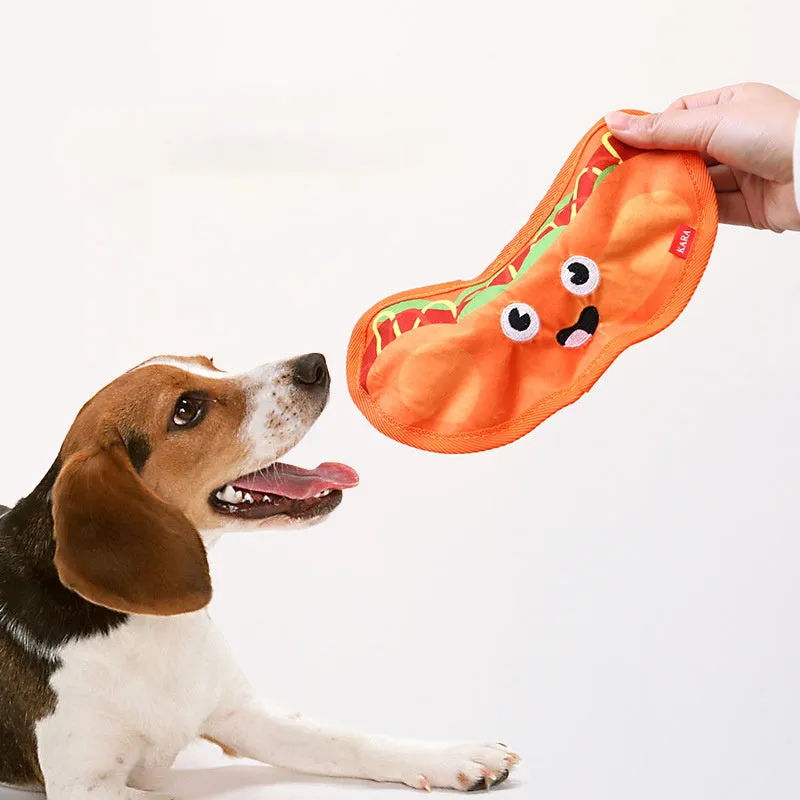 Set of four colourful fast-food shaped dog toys: hamburger, fries, hot dog, and pizza, featuring crinkle and squeak sounds.