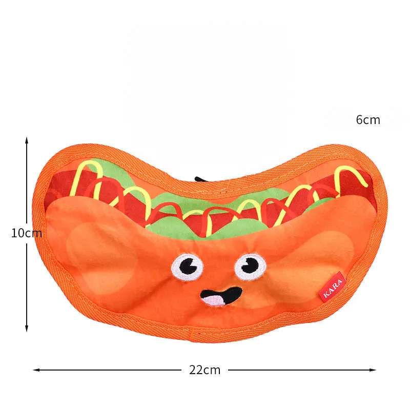 Set of four colourful fast-food shaped dog toys: hamburger, fries, hot dog, and pizza, featuring crinkle and squeak sounds.