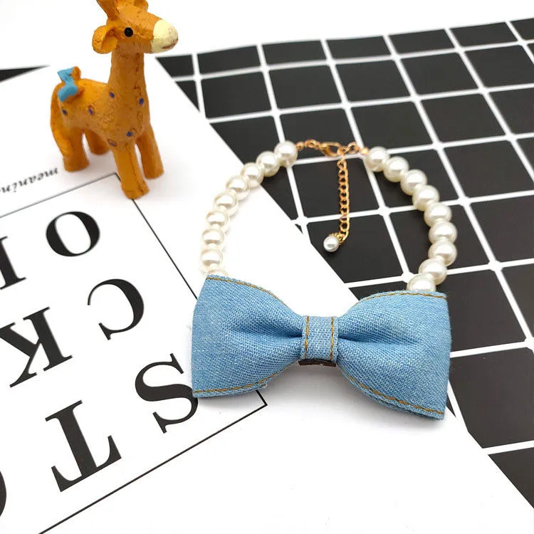 Pet necklace with denim bow and pearl pendant on a metal chain for cats and dogs in princess-style bib