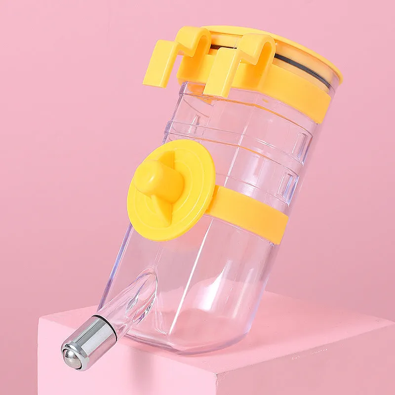 No drip dog kennel water bottle dispenser with dripless nozzle, hanging in a crate, available in blue, green, pink, and yellow