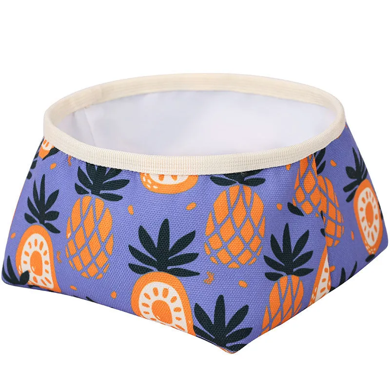 Waterproof foldable dog food bowl in purple polyester and PEVA material on a flat surface