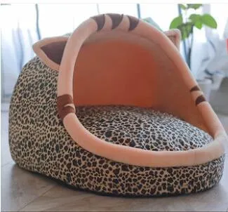 Washable pet kennel bed in brown leopard pattern, size M, on a wooden floor, showing non-slip bottom and removable cover.