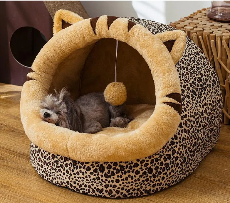 Washable pet kennel bed in brown leopard pattern, size M, on a wooden floor, showing non-slip bottom and removable cover.