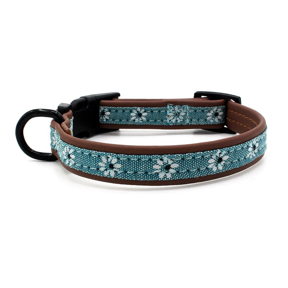Plastic buckle dog collar in light blue with adjustable nylon webbing on white background