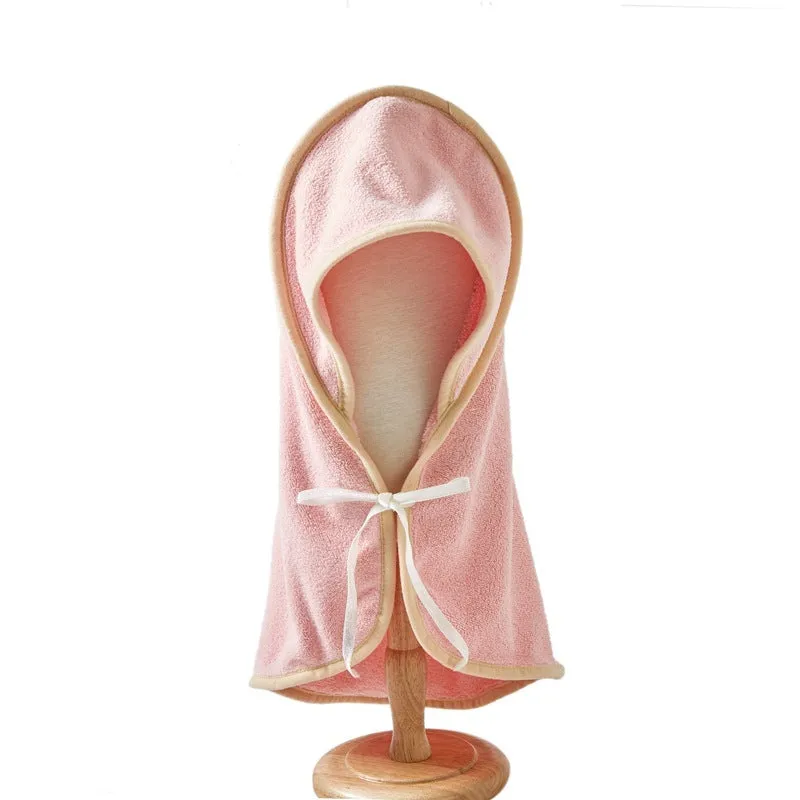 Microfiber pet quick-drying bathrobe in beige, folded on surface