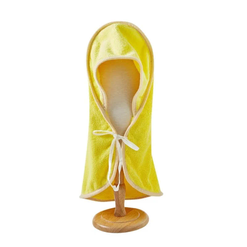 Microfiber pet quick-drying bathrobe in beige, folded on surface