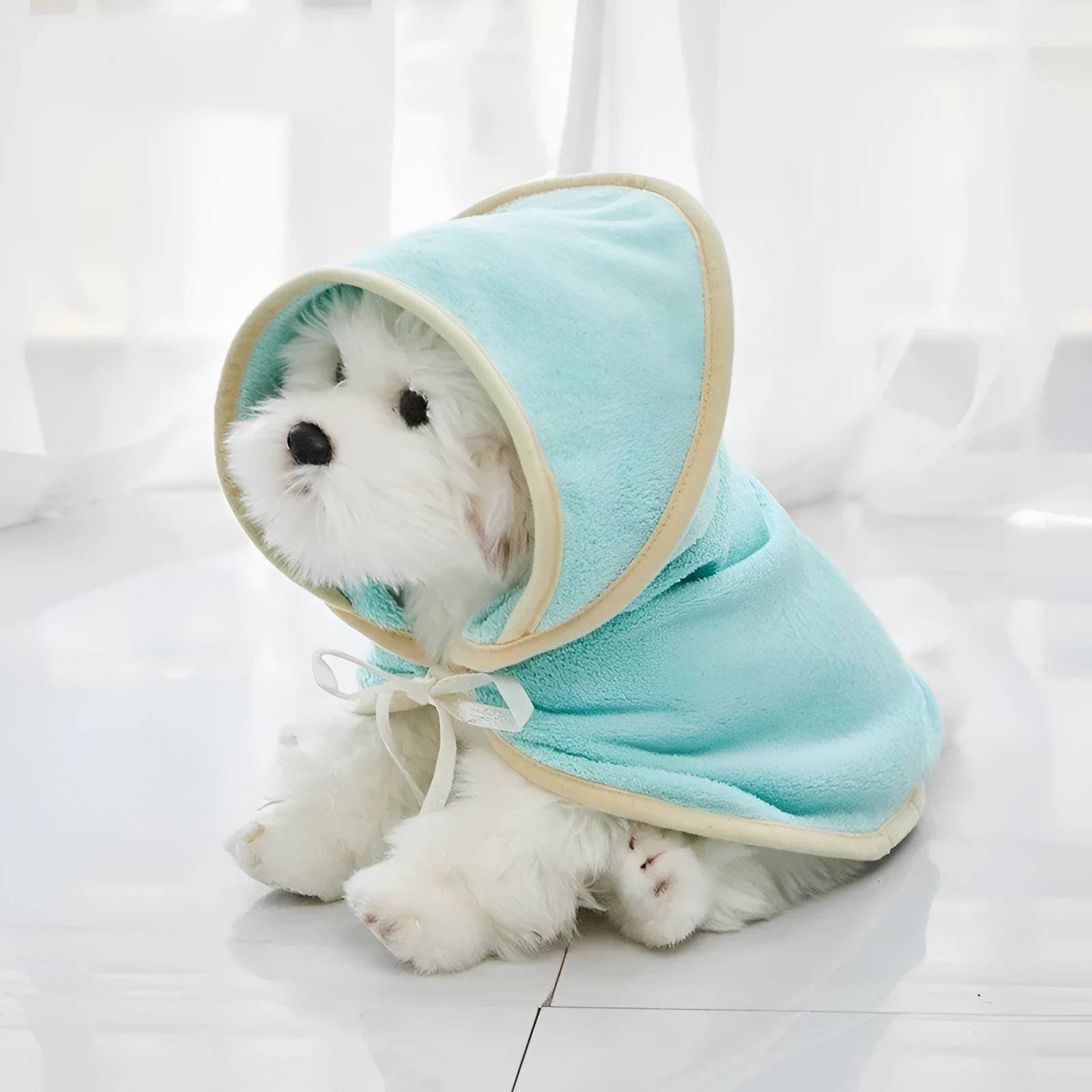 Microfiber pet quick-drying bathrobe in beige, folded on surface