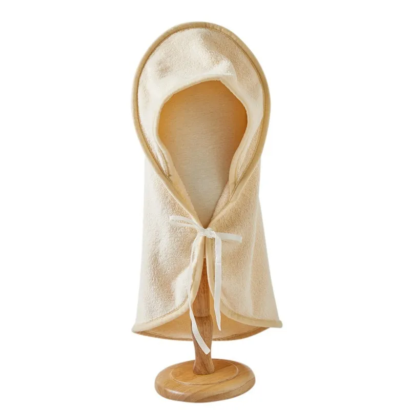 Microfiber pet quick-drying bathrobe in beige, folded on surface