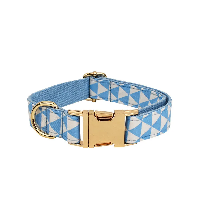 Blue triangular ring on a cloth dog collar and lead set with matching bow and vest, shown in a four-piece pet accessory package.