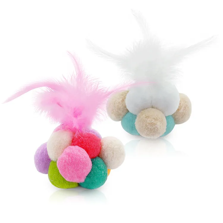 Cat toy feather bouncy ball with colourful pink feathers and blue white feathers for interactive play