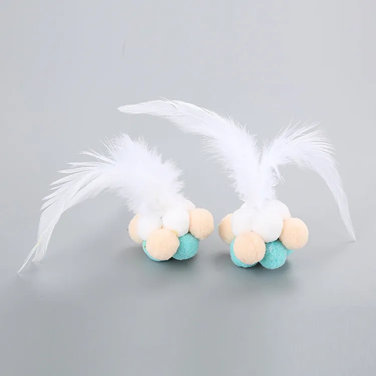 Cat toy feather bouncy ball with colourful pink feathers and blue white feathers for interactive play
