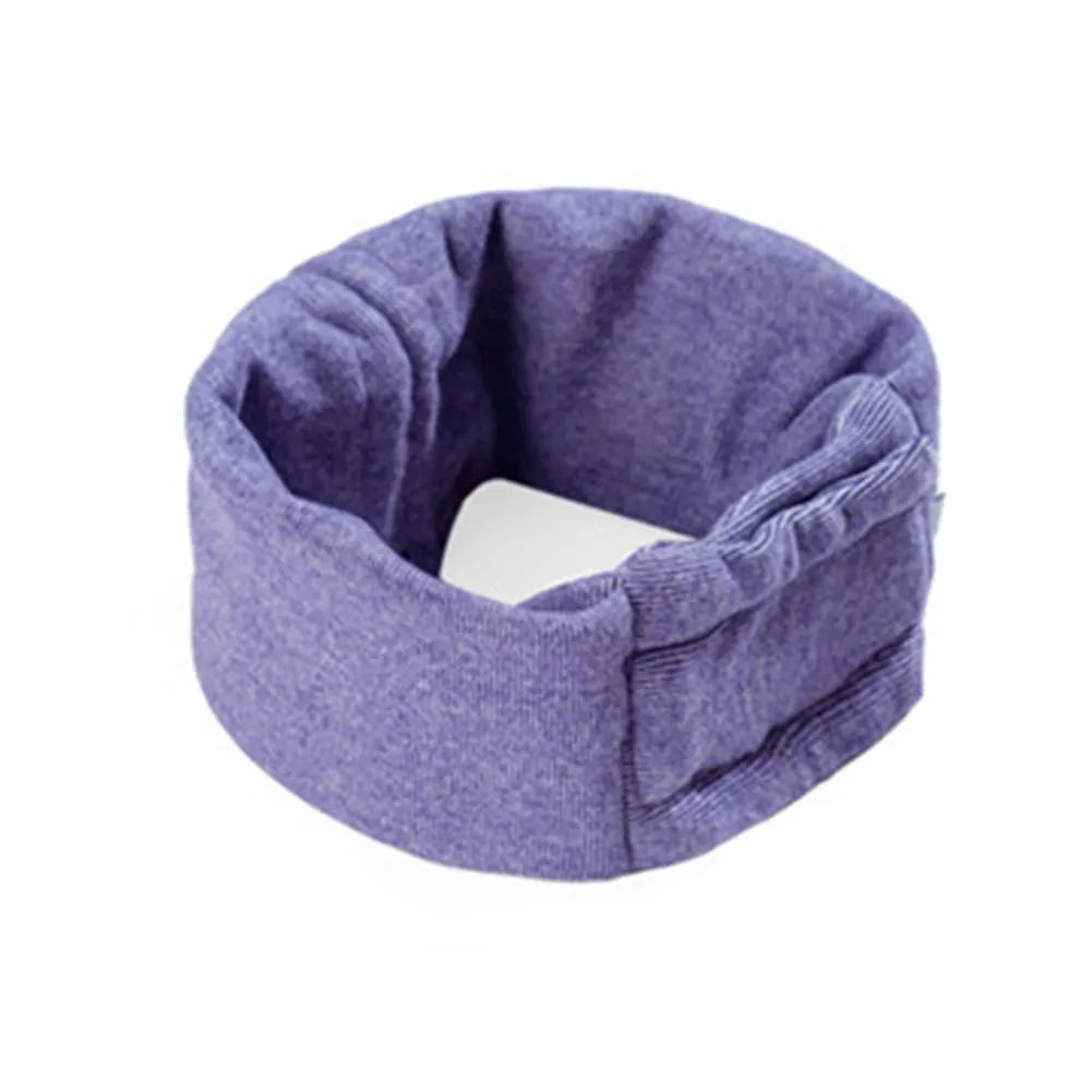 Dog wearing purple calming hoodie with ear muffs covering head and neck