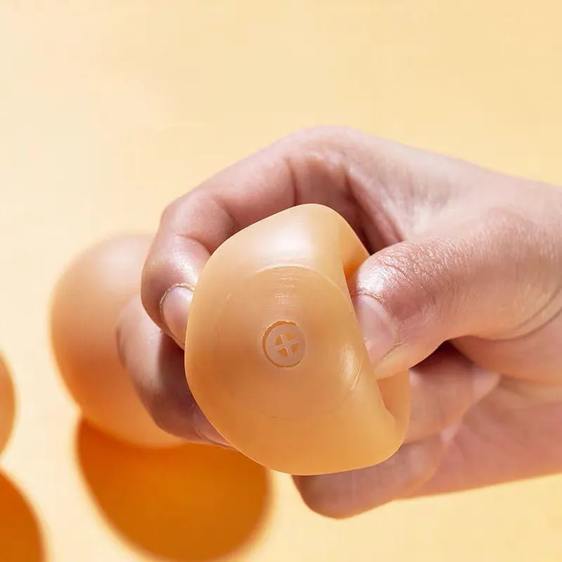 Simulation egg-shaped dog chew toy with squeaker sound for dental play