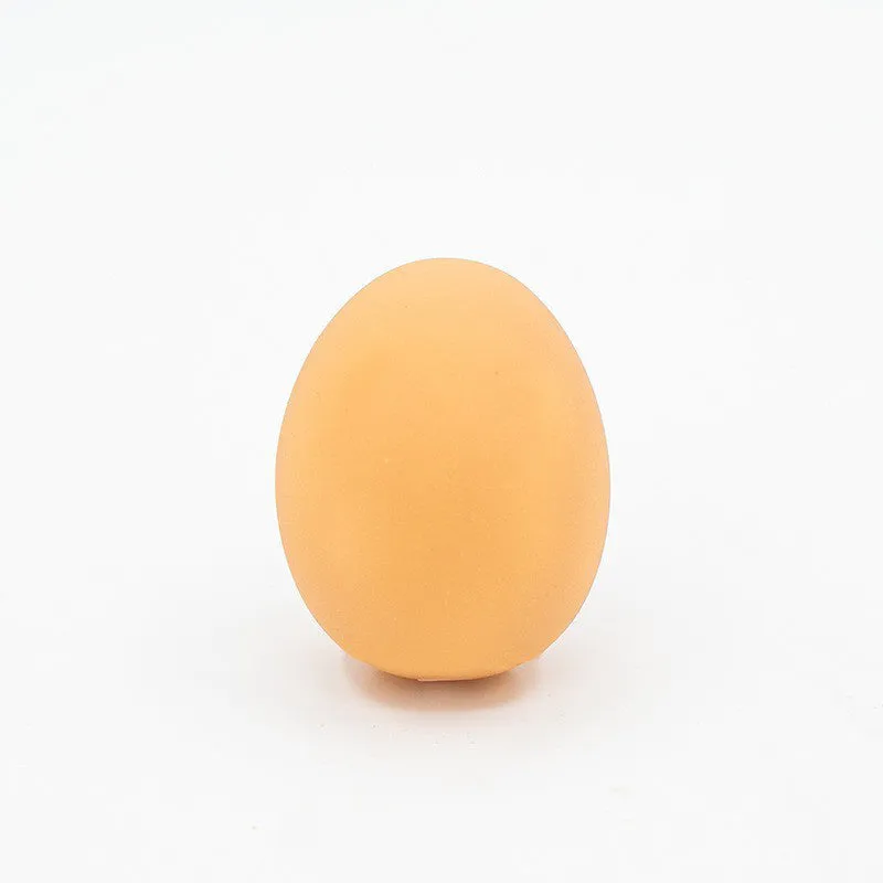 Simulation egg-shaped dog chew toy with squeaker sound for dental play