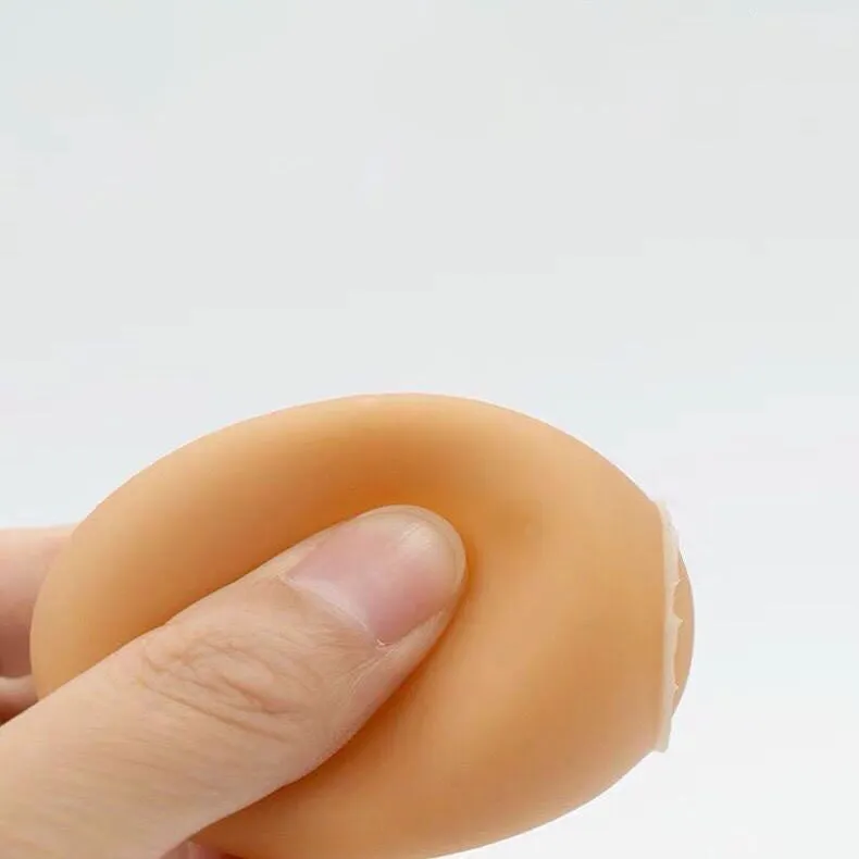 Simulation egg-shaped dog chew toy with squeaker sound for dental play