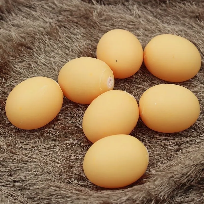 Simulation egg-shaped dog chew toy with squeaker sound for dental play