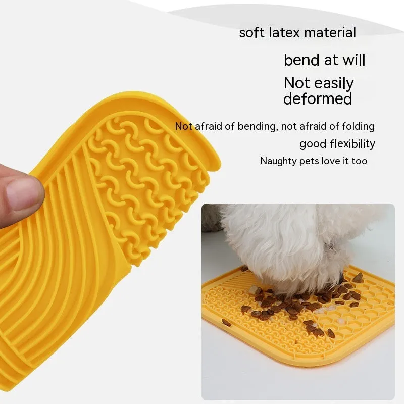 Gray silicone anti-choke slow feeding dog licking pad with textured surface on a flat surface
