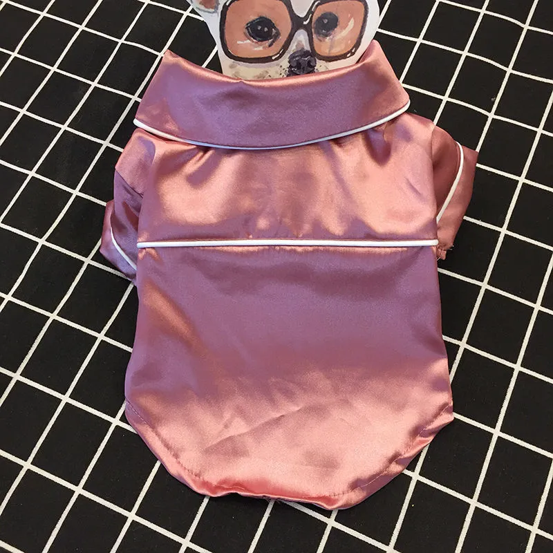 Fashion Personality Teddy Dog Clothing in pink pajamas style for a small dog, made from polyester, on a plain background