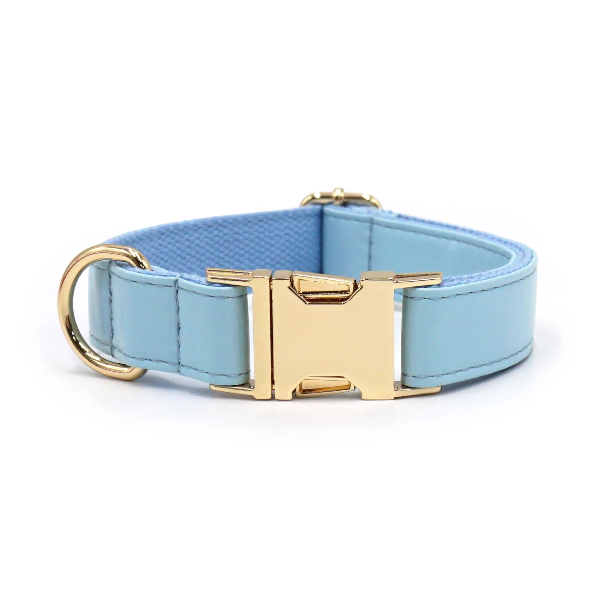 Leather dog collar with velvet texture section in colour block design, shown on a buckle.