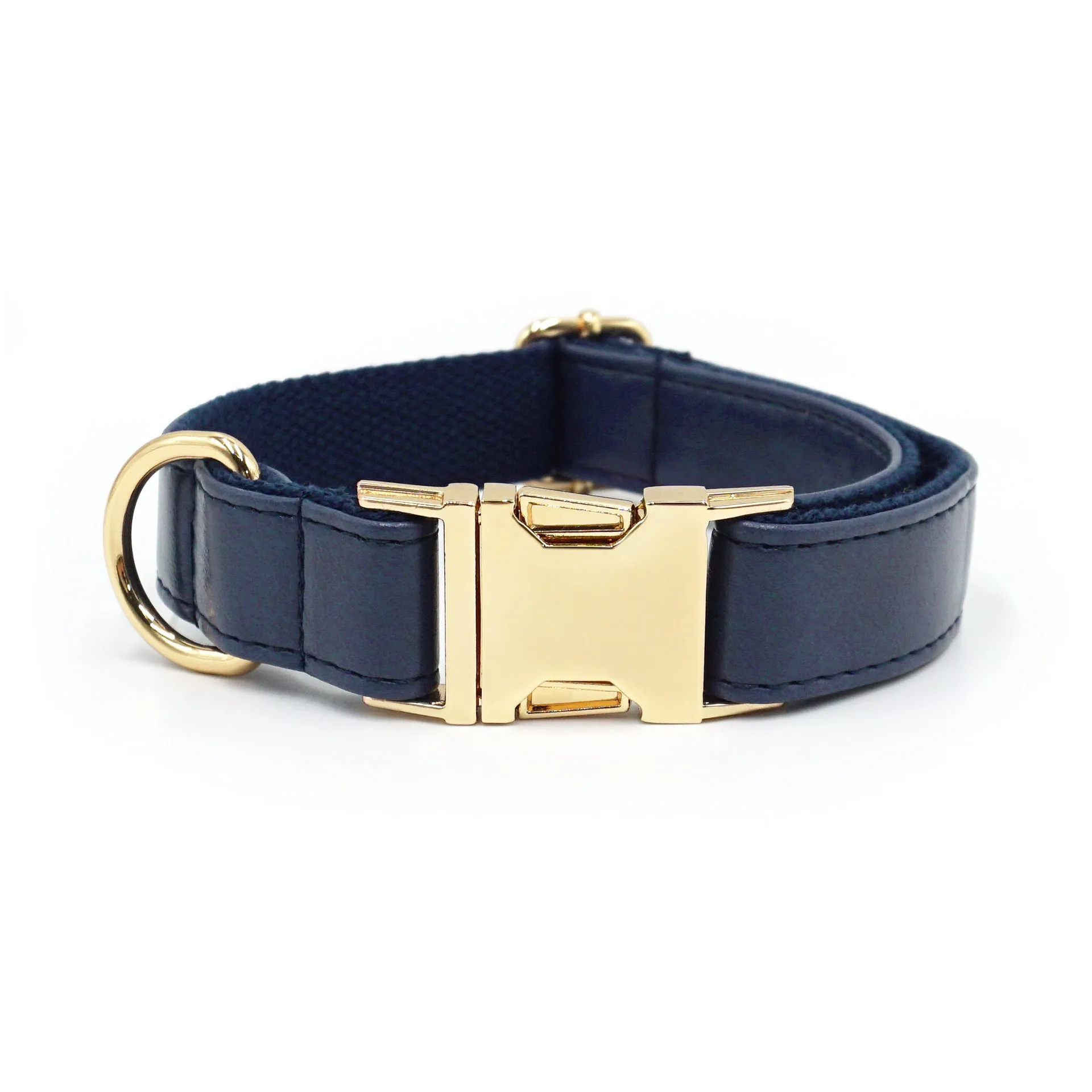 Leather dog collar with velvet texture section in colour block design, shown on a buckle.