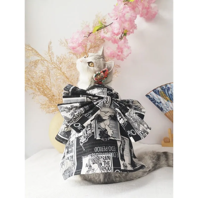 Small dog wearing a cherry blossom print kimono-style pet clothing in a standing pose
