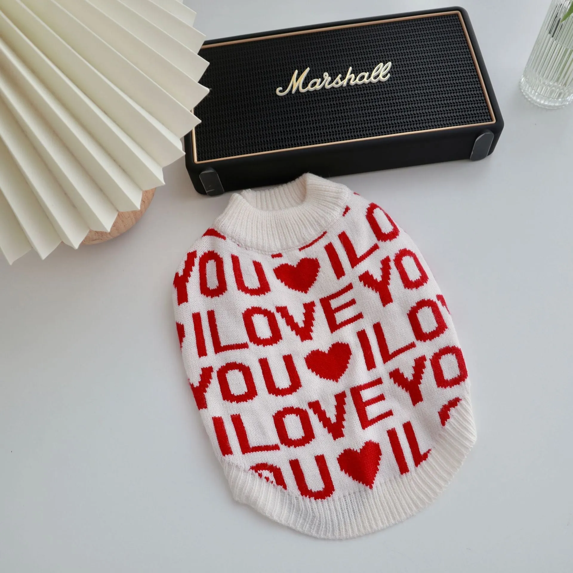 Red dog padded warm sweater made from rabbit velvet core-spun yarn on white background