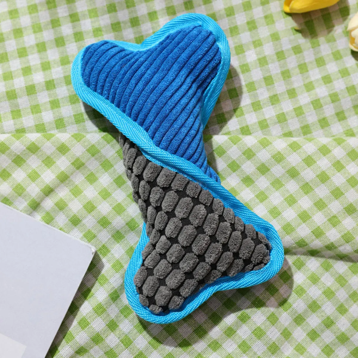 Blue teddy dog toy with bone squeaker and soft corn fleece lining