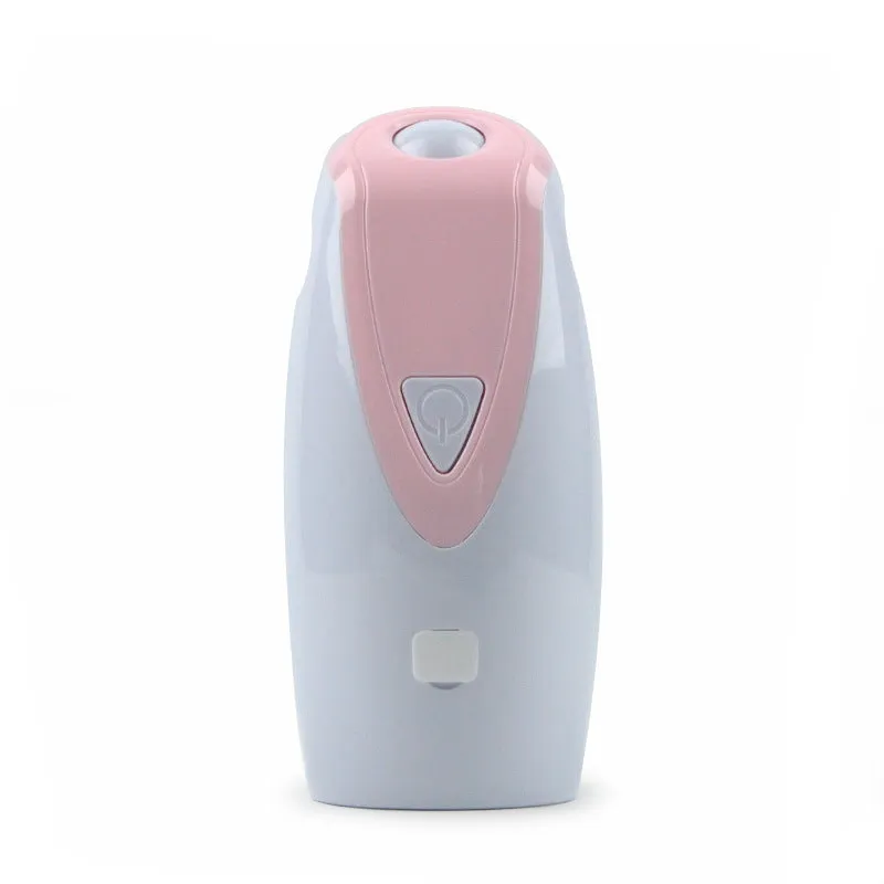 Green USB charging automatic rotating laser cat toy with ABS plastic body on a table