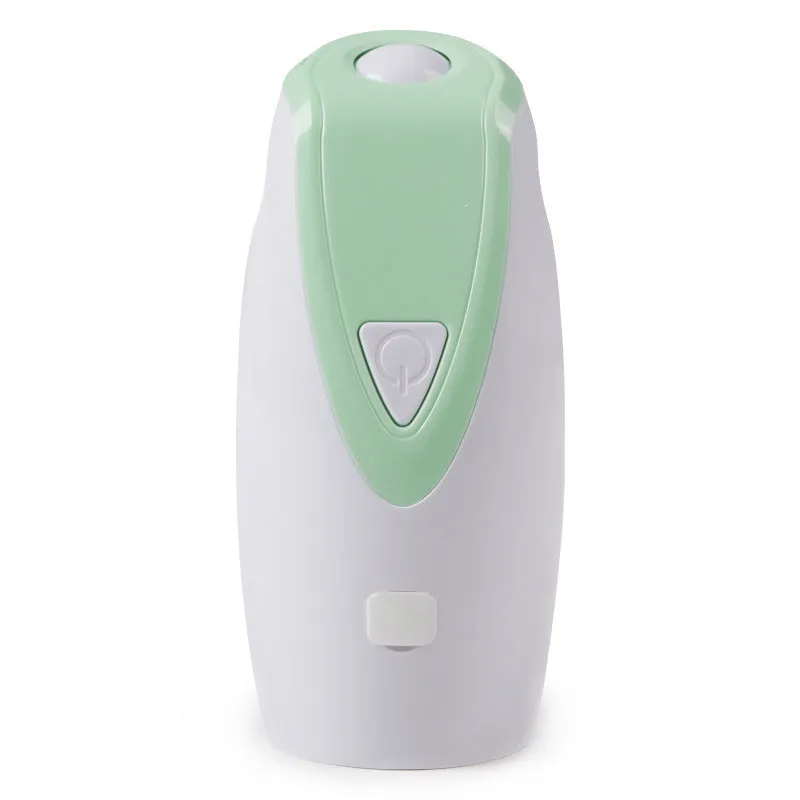 Green USB charging automatic rotating laser cat toy with ABS plastic body on a table