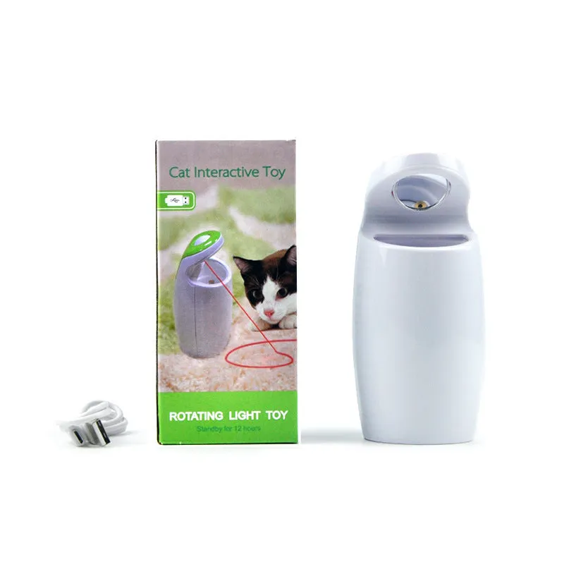 Green USB charging automatic rotating laser cat toy with ABS plastic body on a table
