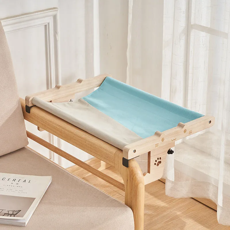 Wooden framed cat hanging hammock bed mounted on a window sill, available in seven style variations.