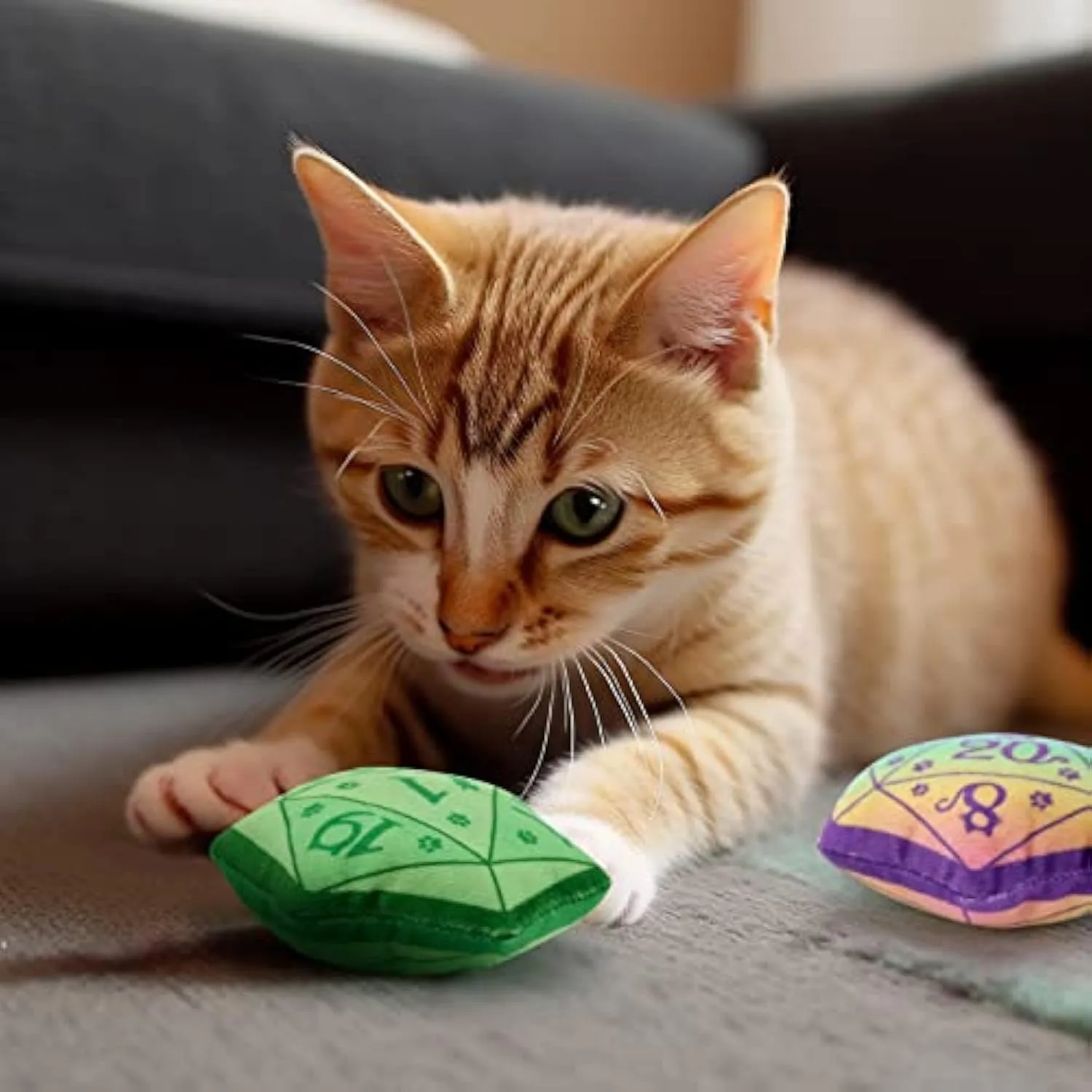 Blue dice-shaped catnip toy with dot markings on cube faces