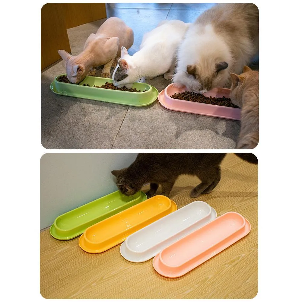 Green dual-compartment pet bowl with removable stainless steel insert and non-slip silicone base