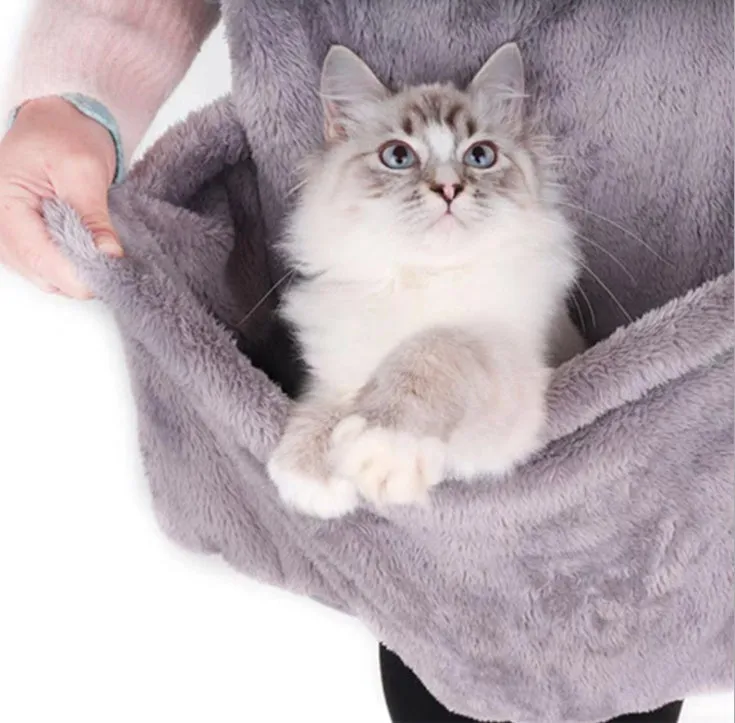 Grey pet out cat carrying bag with sleeping chest apron on a neutral background
