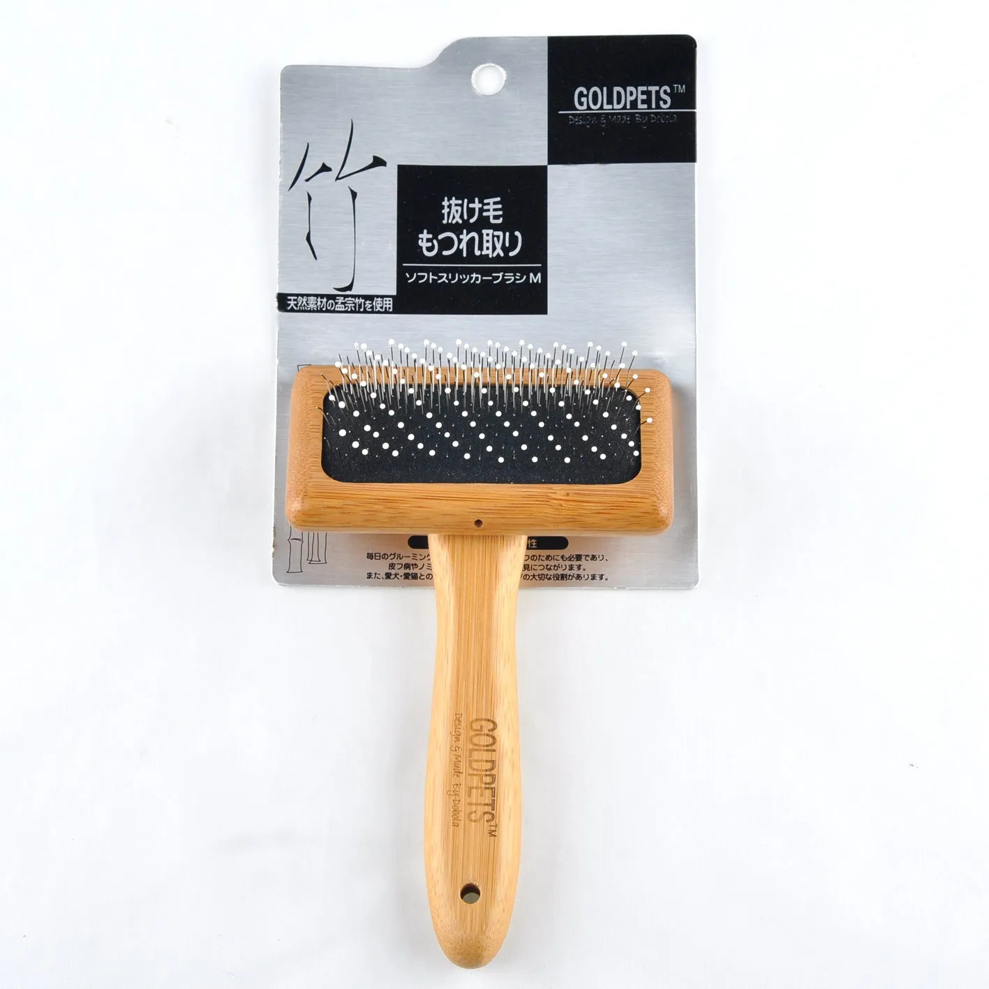 Pet grooming bamboo wood air cushion needle comb with original bamboo colour handle and steel pins on a clean background