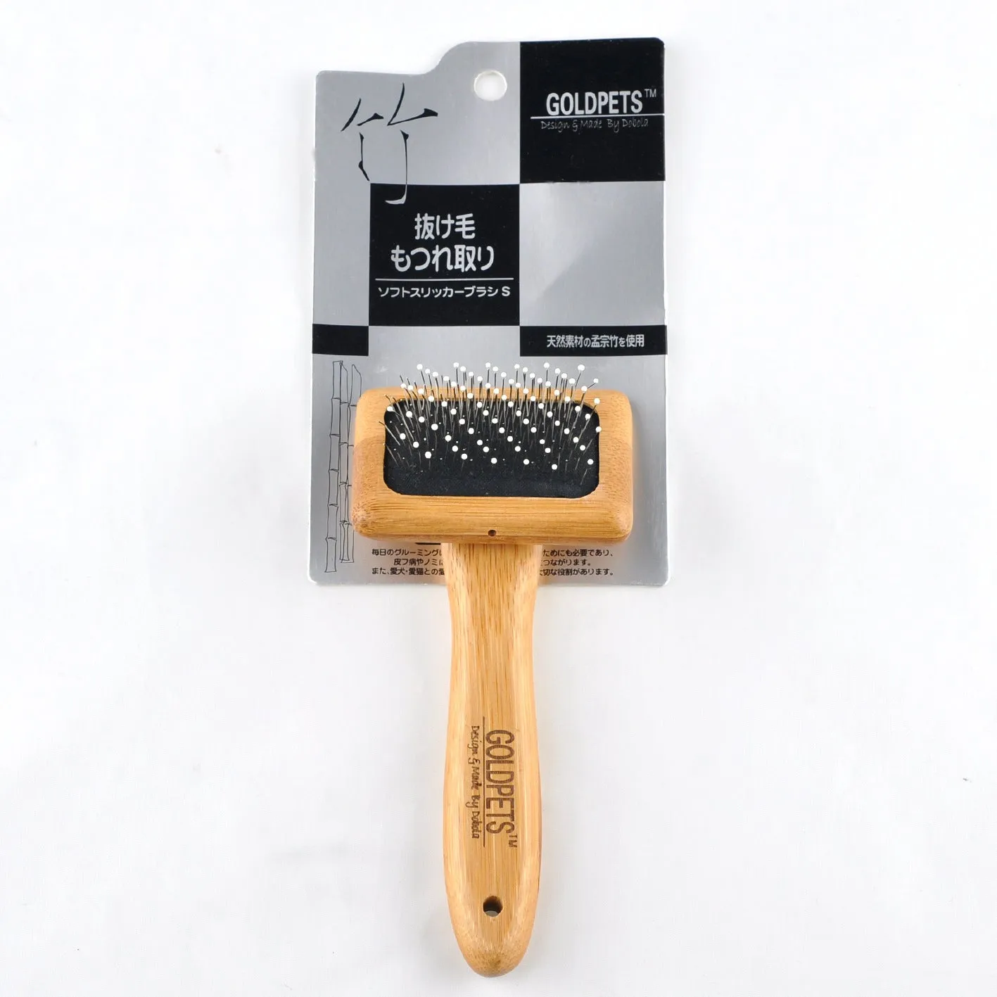 Pet grooming bamboo wood air cushion needle comb with original bamboo colour handle and steel pins on a clean background