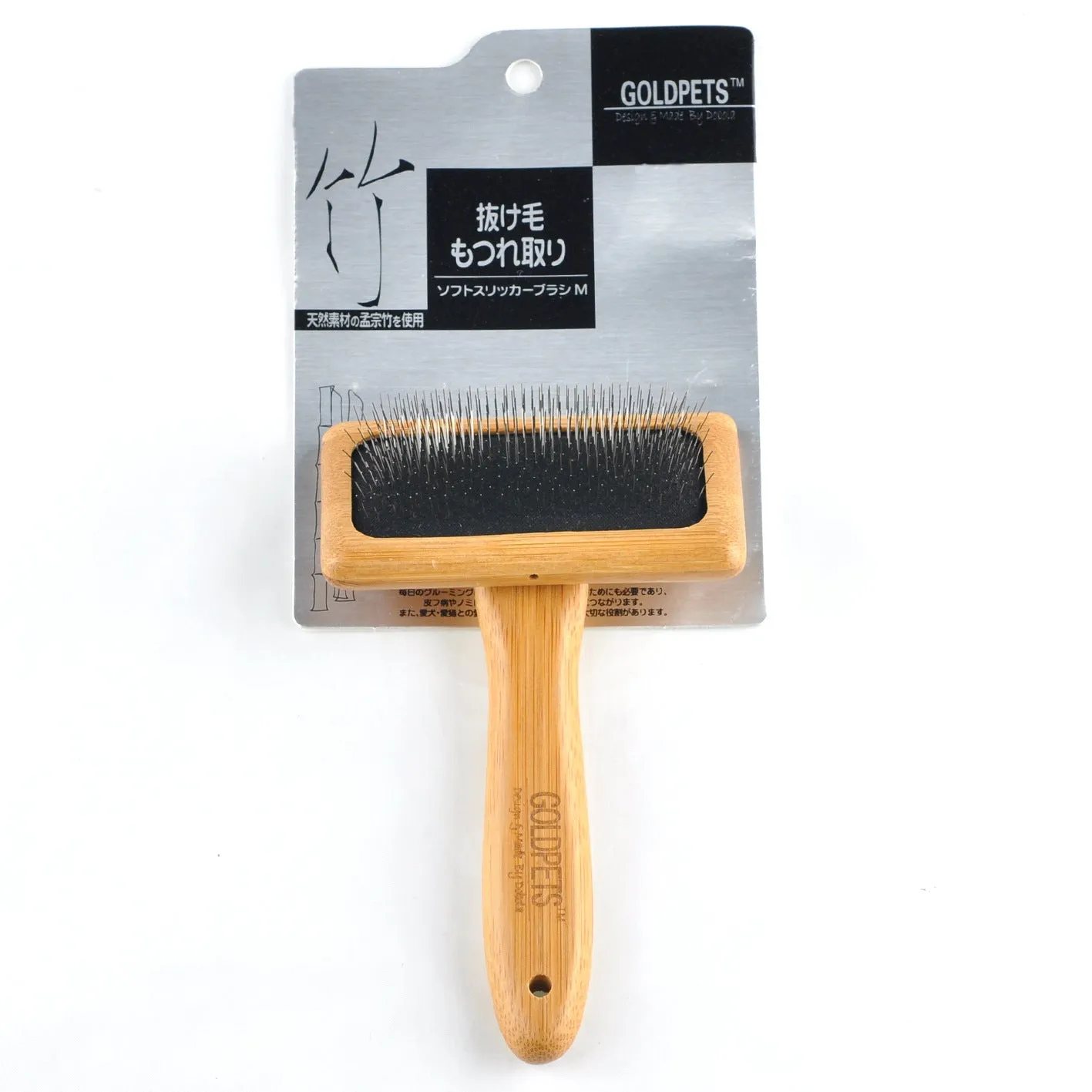 Pet grooming bamboo wood air cushion needle comb with original bamboo colour handle and steel pins on a clean background