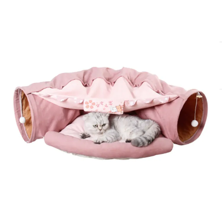 Dismantling and washing pet litter cat tunnel in green cloth with a cat inside