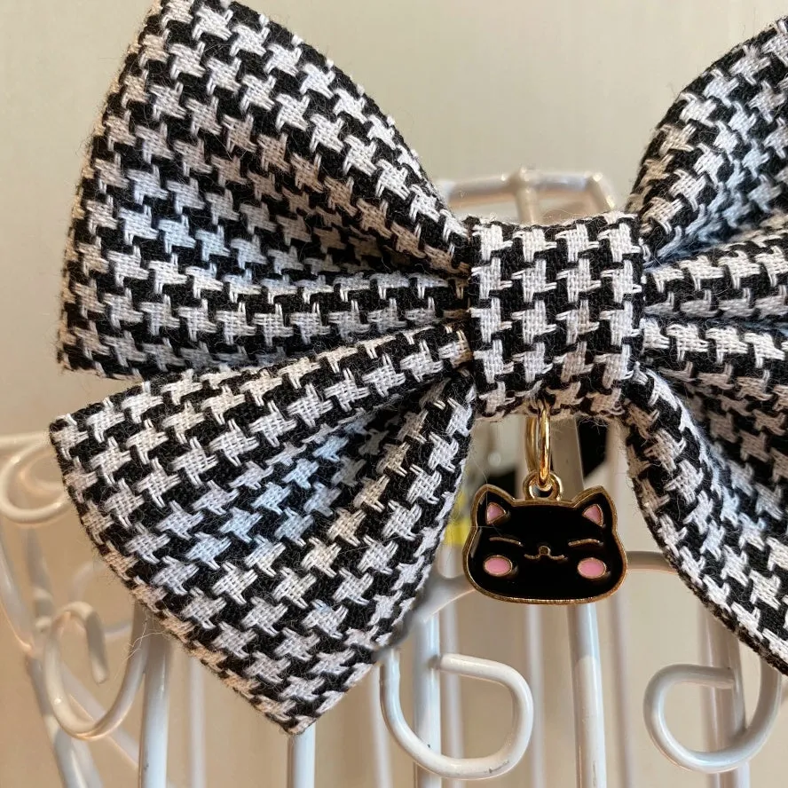 Cloth pet bow tie decoration in wine red checkered pattern with bell on a cat collar