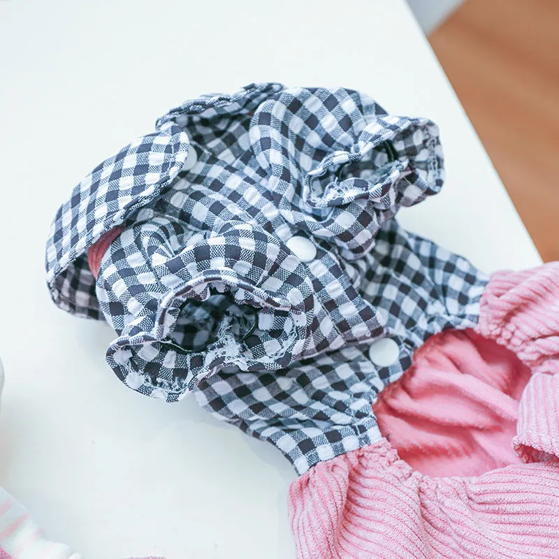 Four-legged plaid overalls for pets in polyester, black grid top, shown on a dog indoors