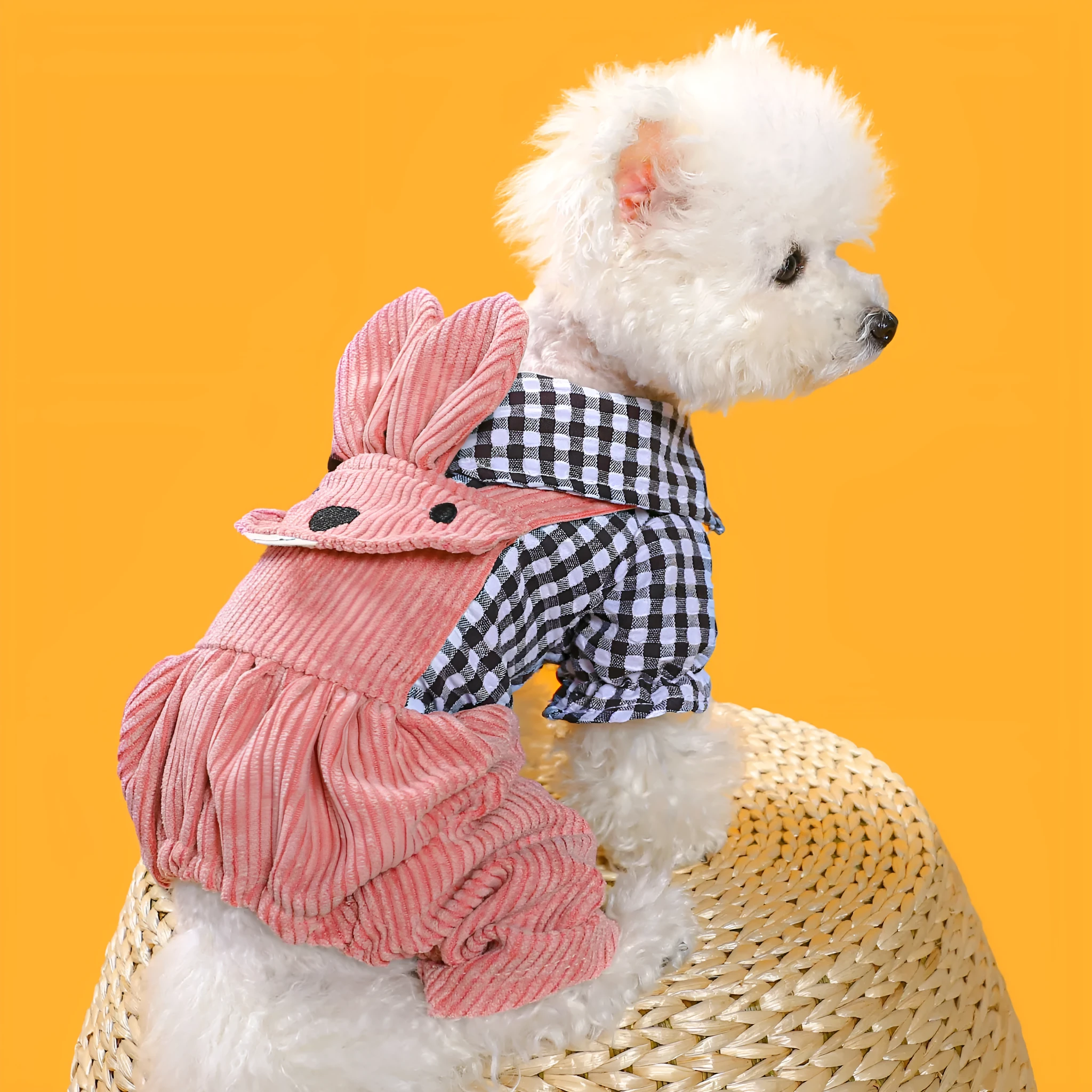 Four-legged plaid overalls for pets in polyester, black grid top, shown on a dog indoors