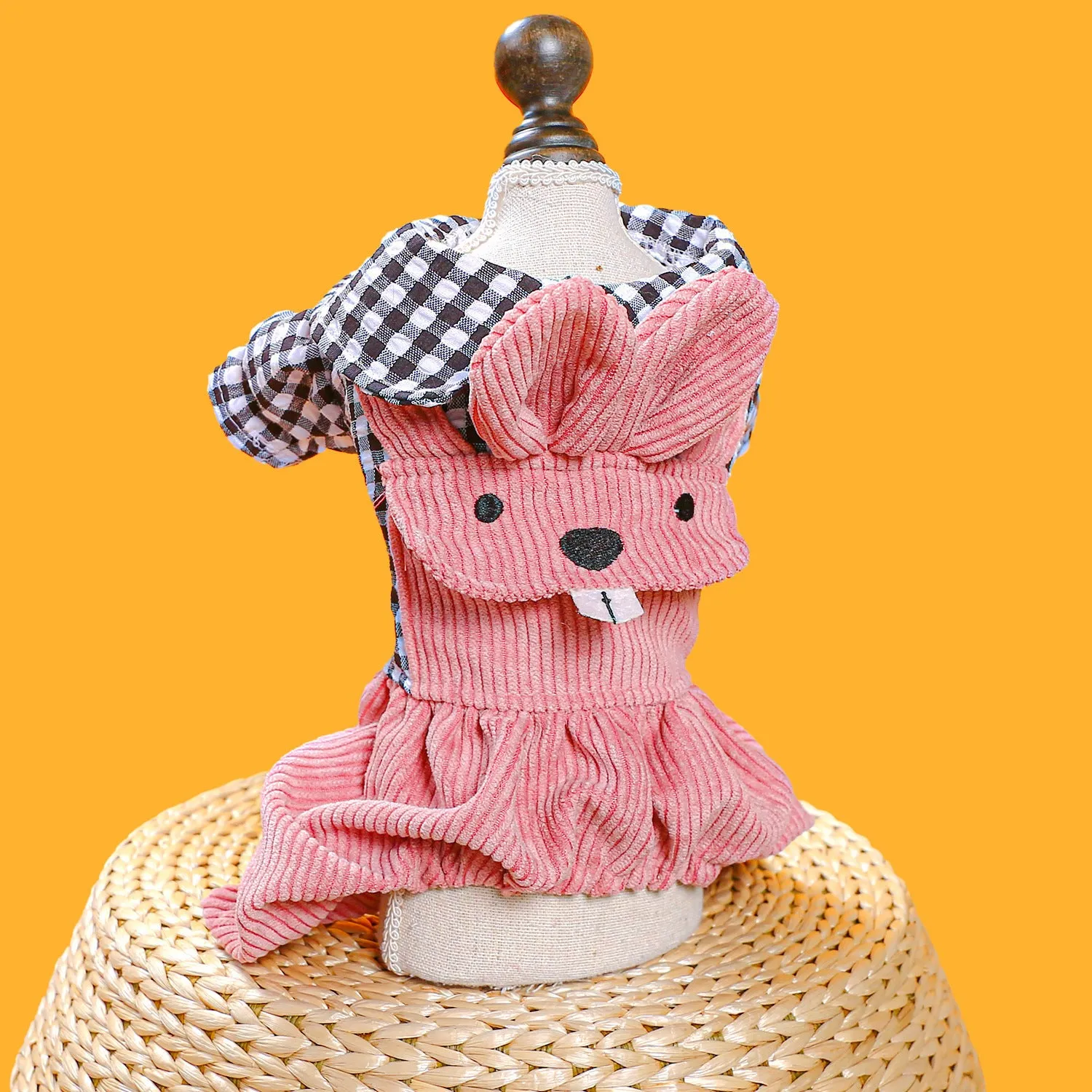 Four-legged plaid overalls for pets in polyester, black grid top, shown on a dog indoors