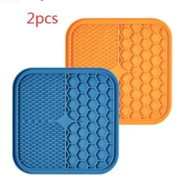 Blue silicone suction cup licking pad for dogs with grooved slow-feeding surface on a tile floor